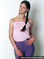 Teen brunette posing on the floor