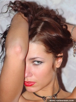 Russian teen brunette posing naked on the bed