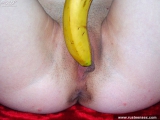 Russian teen masturbates her shaved pussy with banana