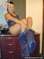 Brunette ripping tan pantyhose