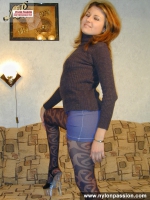 Teen blonde in black pantyhose posing