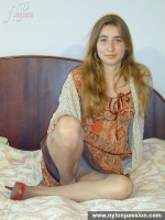 Pantyhose loving blonde girl enjoys her nylon legs