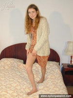 Pantyhose loving blonde girl enjoys her nylon legs