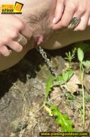 Redhead teen pisses outdoor