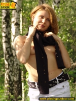 Teen blonde pisses in the grass