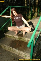 Pissing on a concrete park ladder