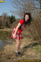 Pissing outdoor near the pond