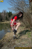 Pissing outdoor near the pond