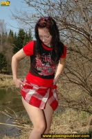 Pissing outdoor near the pond