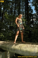 Teen blonde pissing outdoor on tubes