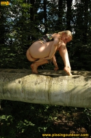 Teen blonde pissing outdoor on tubes