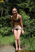 Teen blonde pissing pool in a park