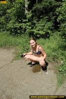 Teen blonde pissing pool in a park