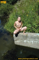 Pissing teen blonde pisses in the pool outdoor