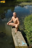 Pissing teen blonde pisses in the pool outdoor