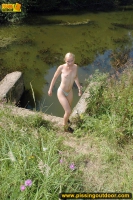 Pissing teen blonde pisses in the pool outdoor