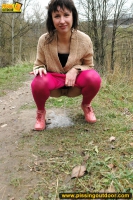 MILF brunette walks outdoor and pissing in the nature