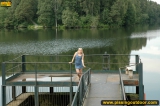 Outdoor pissing on a village embankment
