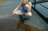 Outdoor pissing on a village embankment