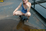 Outdoor pissing on a village embankment