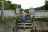 Outdoor pissing on a village embankment