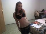 Girl next door rubbing her pussy in bed