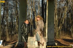 Two girls outdoor pissing on stone columns - N