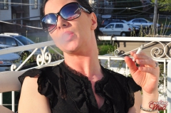 Brunette babe smoking at the terrace - N