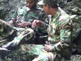 Army boys scout for hard meat outdoors