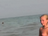 Stunning fresh-faced teenager plays in the beach naked