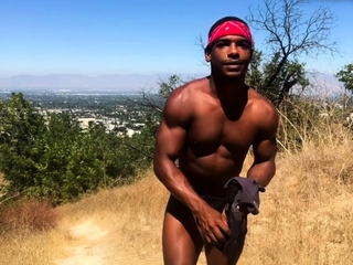 Ripped black stud masturbates outdoors
