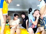 Two randy gay fellas giving blowjobs in group sex action