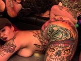 Wild eight girl orgy with busty tattooed hotties