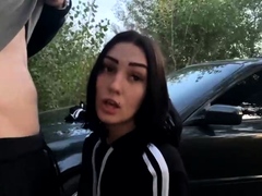 Brunette gives mass blowjob outdoors