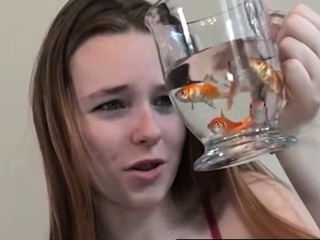 Pretty hungry girl swallows innocent fish - Vore