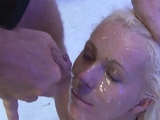 Curly haired blondie slurps two dicks for facial love